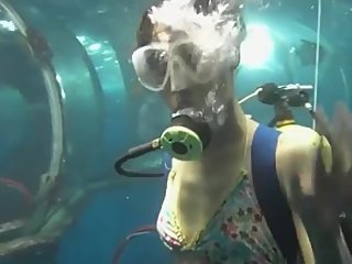 Japanese scuba girl at undersea world